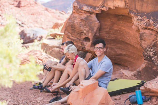istock Group of climbers at base of rock geting ready to climb 1155773146