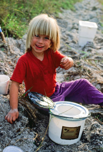 istock Yound child holding up fish bait 1155776565