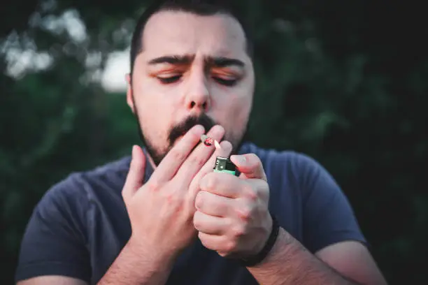 Photo of Lighting up marijuana cannabis joint