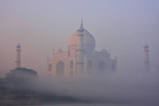 View of Taj Mahal in early morning fog, Agra, Uttar Pradesh, India stock photo