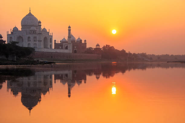 istock Taj Mahal reflected in Yamuna river at sunset in Agra, India 1155781915