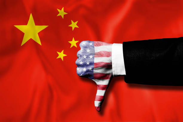 istock CHINA flag with thumbs down USA hand with flag / Flag concept (Click for more) 1155784740
