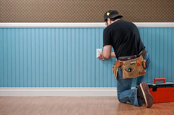 Photo of Handyman Working In Empty Room