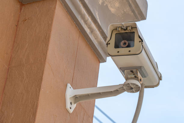 istock home security cameras or home surveillance cameras on a wall, video protection safety system guard 1155794348
