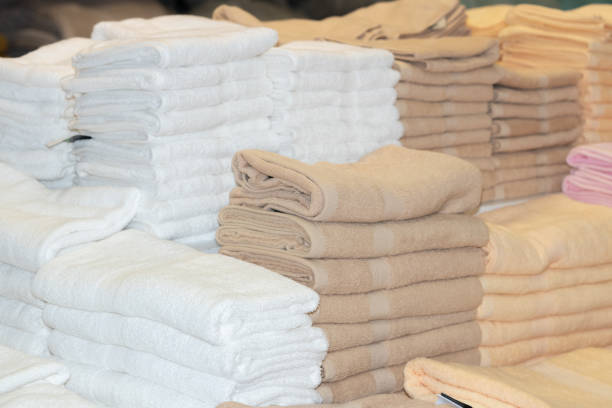 istock Clean White Towels and Brown Towels on shelf 1155794621