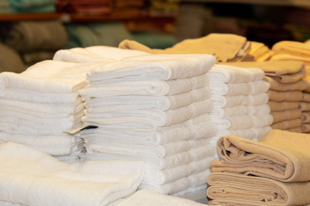 istock Clean White Towels and Brown Towels on shelf 1155796477