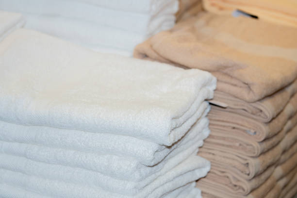 istock Clean White Towels and Brown Towels on shelf 1155796954