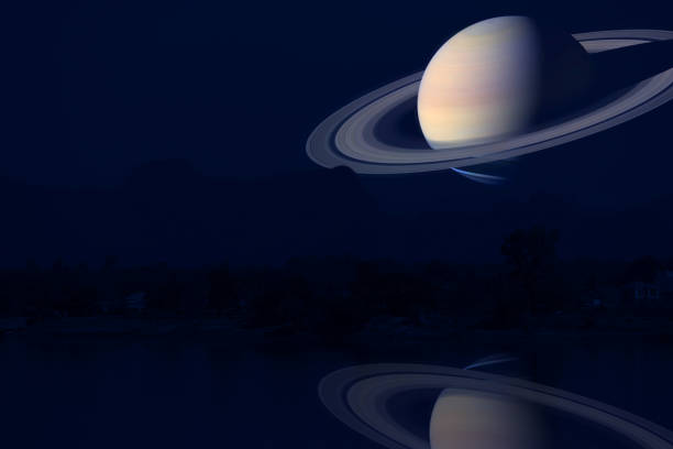 istock reflection Saturn on night sky back silhouette mountain and river 1155797023