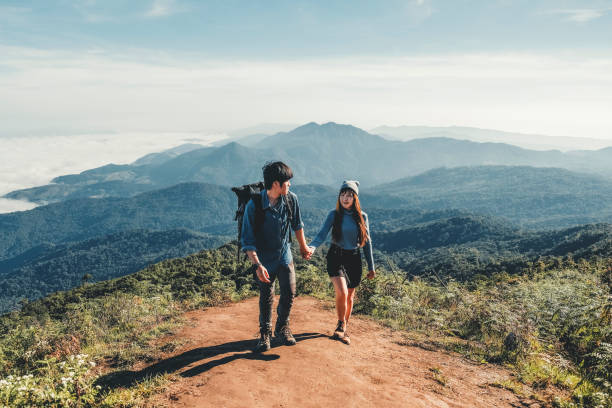 istock Adventures Couple trail hiking in the forest 1155798753