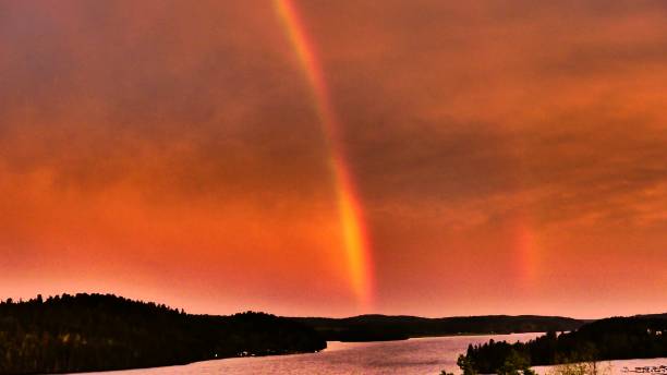 istock Spectacular sunrise with a rainbow 1155803183