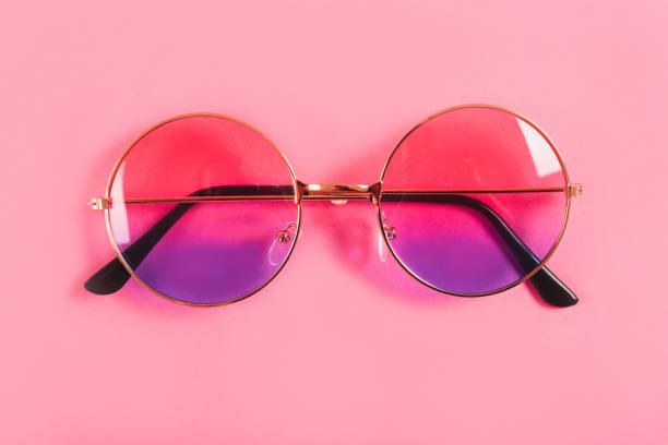 istock Round summer duotone sunglasses on pink background. 1155803201