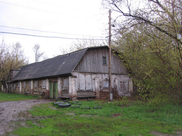 istock old abandoned wooden building stable long barn 1155814251