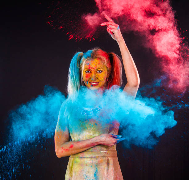istock Young woman covered with paints 1155819600