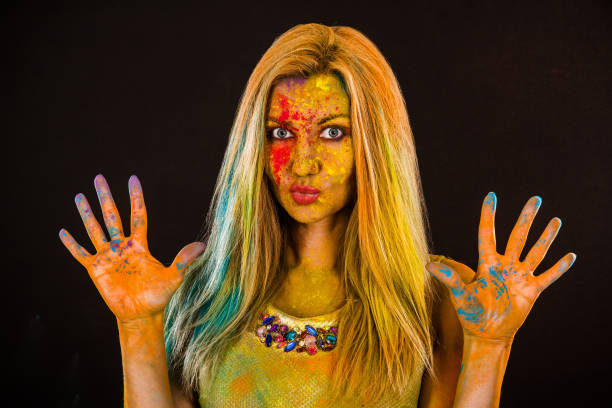 istock Beautiful young woman with colored powder 1155819616