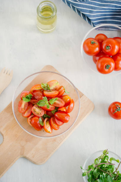 istock Fresh salad with tomato, mozzarella and basil. Concept for a tasty and healthy appetizer 1155820566