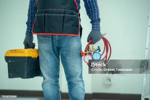 The Technician Is Checking The Air System Stock Photo - Download Image Now - Air Conditioner, Repairing, Technician