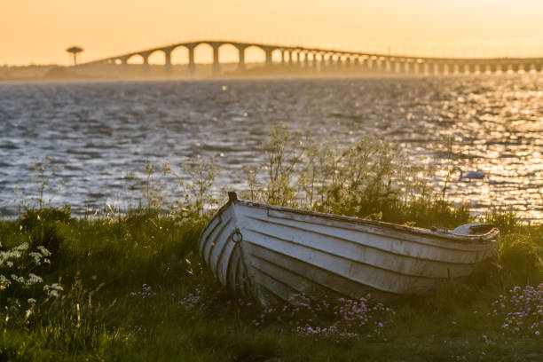 The swedish Oland Bridge with an old rowing boat in the front stock photo