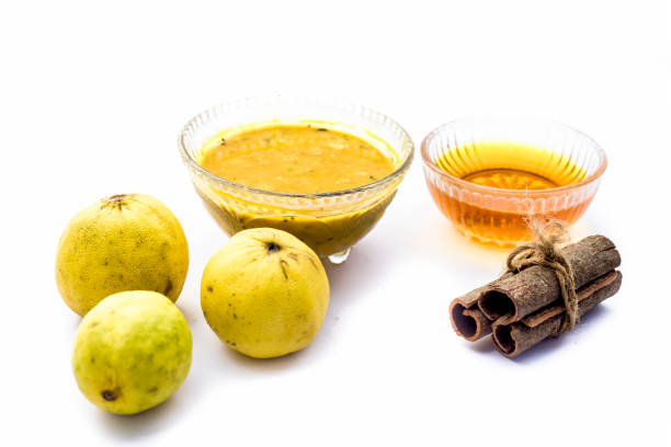 istock Cinnamon face pack isolated on white i.e. Cinnamon powder well mixed with lemon and honey and removes dark spots, eliminates scars, and moisturizes your skin.Entire raw ingredients present. 1155829385