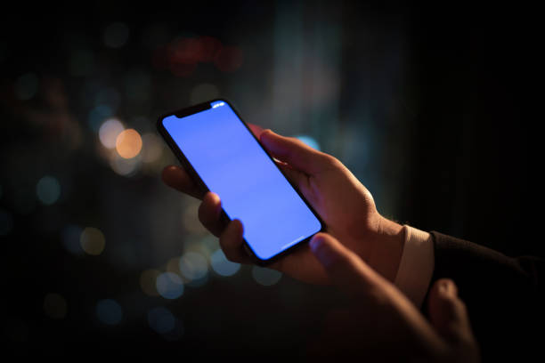 istock People holding mobile phones 1155830965