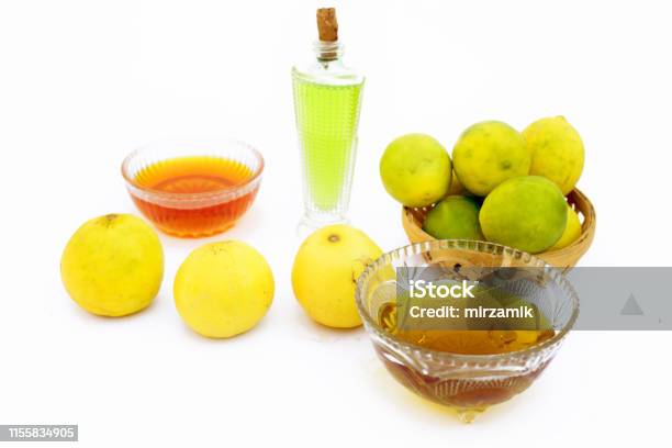 Lemon Hair Growth Mask Isolated On White Ie Lemon Juice Well Mixed With  Honey And Olive Oil In A Glass Bowl With Entire Raw Ingredients Stock Photo  - Download Image Now - iStock
