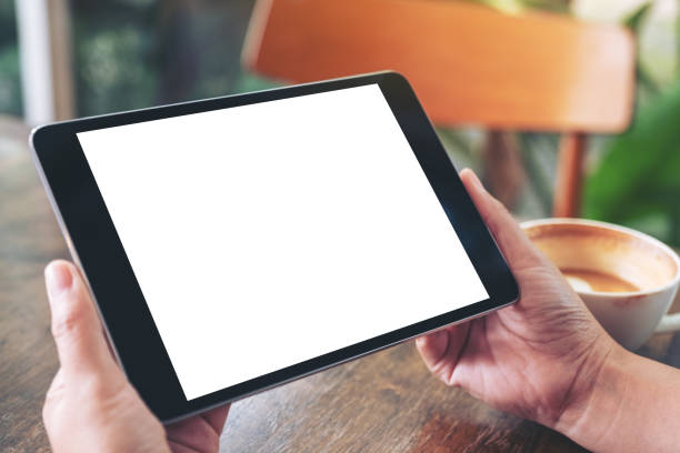 istock a woman holding black tablet pc with blank white screen 1155836373