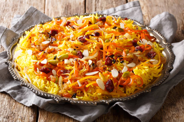 istock Iranian wedding pilaf Javaher Polow or jeweled rice close-up on a plate. horizontal 1155838202