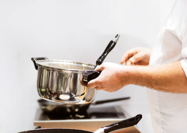 istock Chef cooking food in the kitchen, Chef preparing food 1155840139