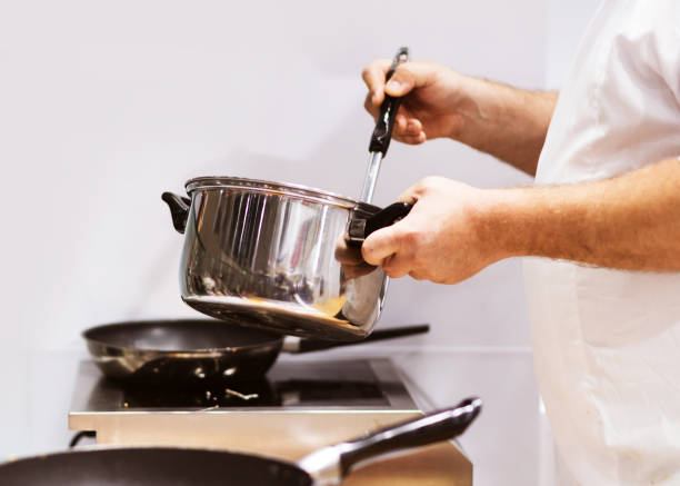 istock Chef cooking food in the kitchen, Chef preparing food 1155840145