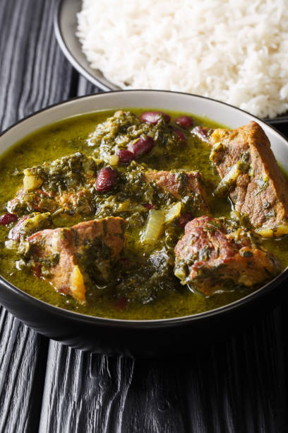 istock Middle Eastern lamb stew meat with herbs and beans close-up in a bowl and rice. vertical 1155840387