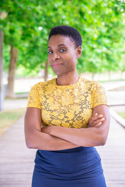 istock Content attractive black with keeping arms crossed outdoors 1155840470