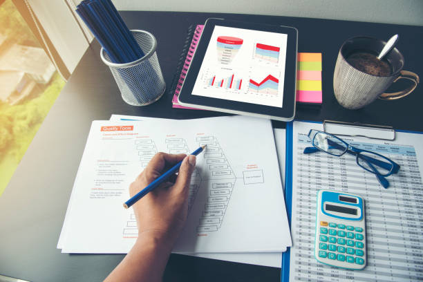 istock Excel graph with Spreadsheet Document showing Information Financial Startup Concept. Financial Planning making Accounting Database Report. Graphs and chart on screen with stationery set business stuff 1155841769
