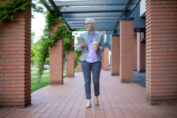 istock Mature grey-haired woman outdoors 1155842606