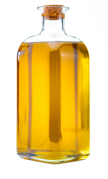 istock Bottle of extra virgin olive oil. Rustic appearance. Isolated on white background. 1155845540