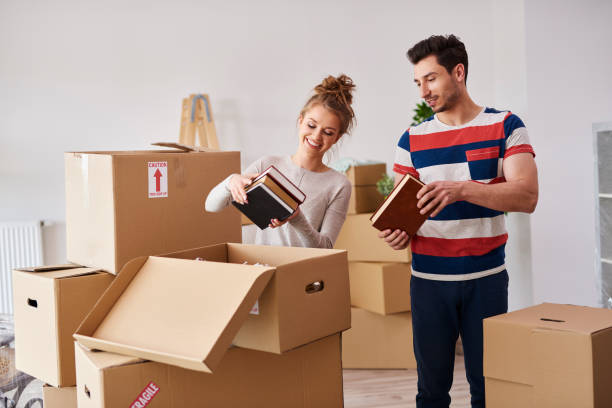 istock Young couple moving in to house 1155851006