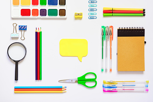 Frame with school supplies on a white background. Flat lay, top view. Back to school concept