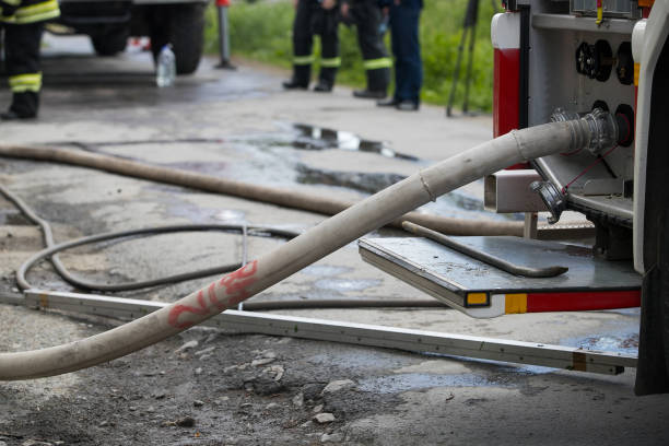 istock Fire extinguishing equipment. Fire hose with a water distribution system. Triple valve for supplying water to hoses. Fire extinguishing equipment. 1155851975