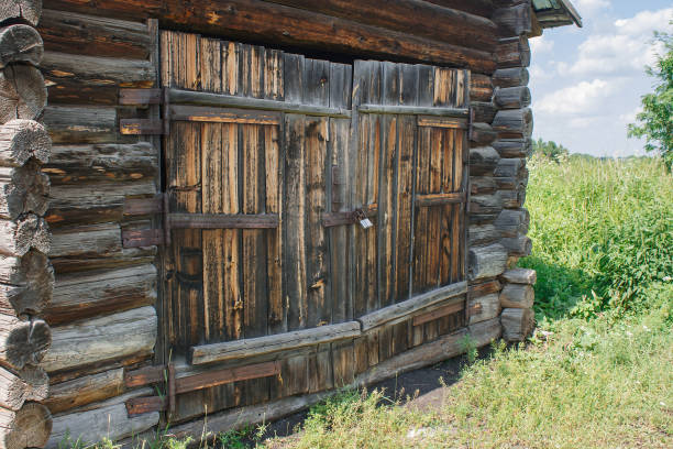 istock brown wooden door of old rustic barn 1155852736