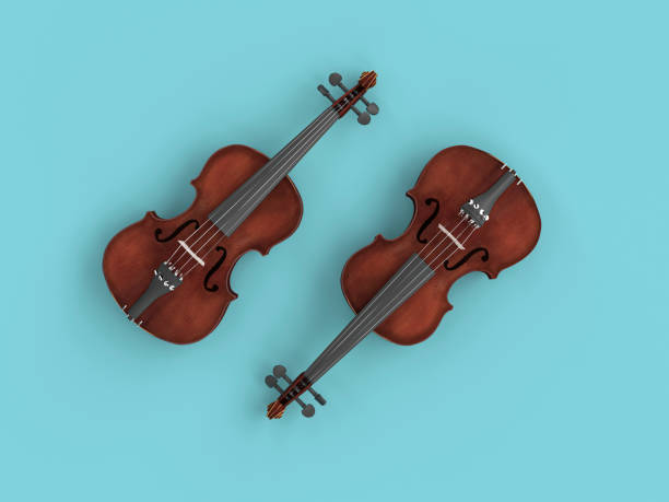 istock pair of violins on a blue background. 1155855044