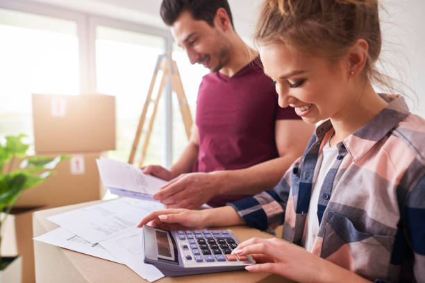 Happy couple planning their budget