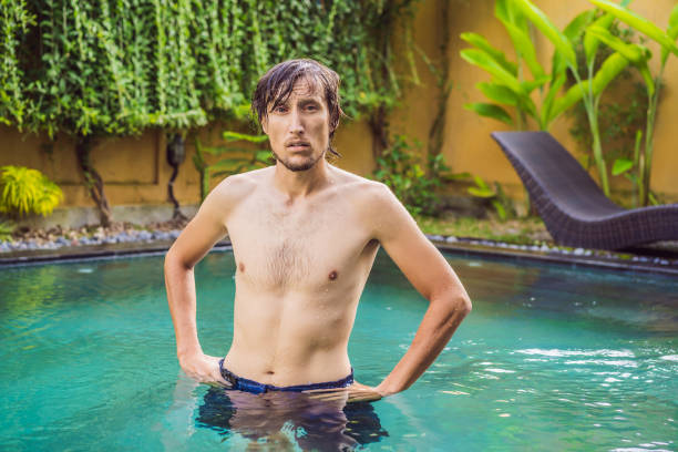 istock The man has red eyes after the pool 1155860012
