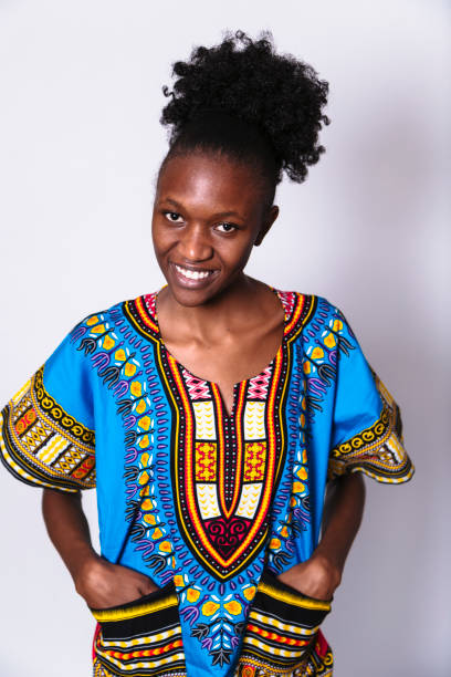 istock African girl standing puts her hands in pokets 1155860481