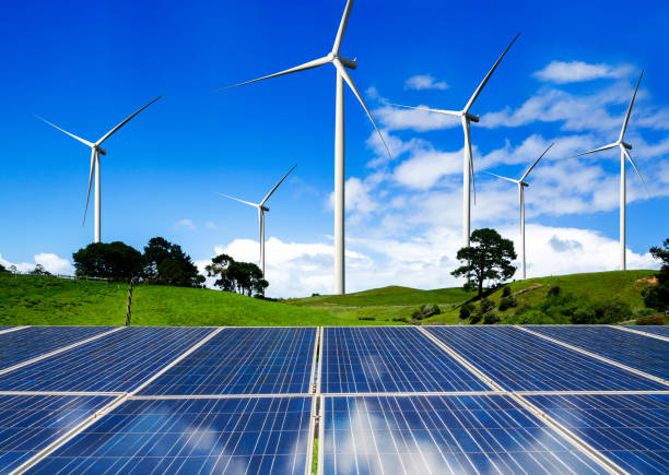 istock Solar panel and wind turbine farm clean energy. 1155861636