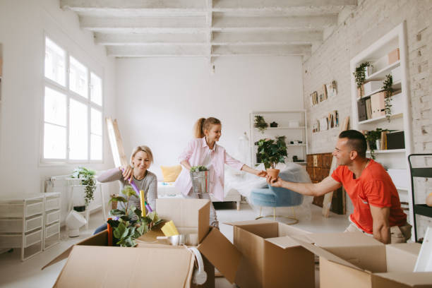 istock Family unpacking stuff for new apartment 1155861682