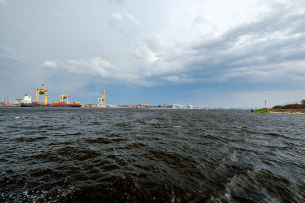 istock storm clouds forming over Riga cargo shipping port on river Daugava 1155864023