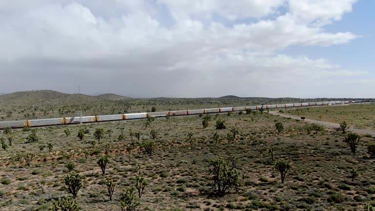 Cargo locomotive railroad engine crossing Arizona desert wilderness