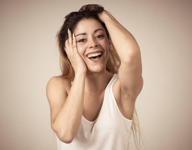 istock Beautiful young blonde woman with happy face making surprised gestures looking at something shocking and good. Human facial expressions and emotions. Portrait with copy space. 1155865833