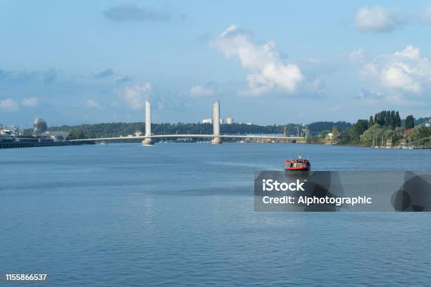 Boat On The Garonne River At Bordeaux With The Pont Jacques Chaban Delmas Bridge Stock Photo - Download Image Now