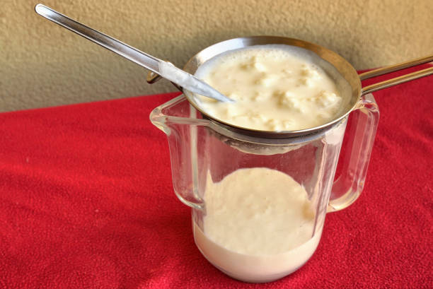 istock Pouring of the Kefir, 1155869403