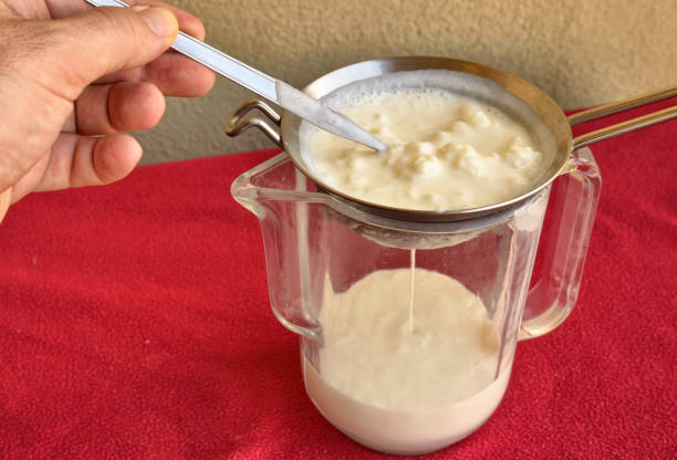 istock Pouring of the Kefir, 1155869435