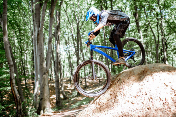 istock Cyclist riding extremely in the forest 1155873314